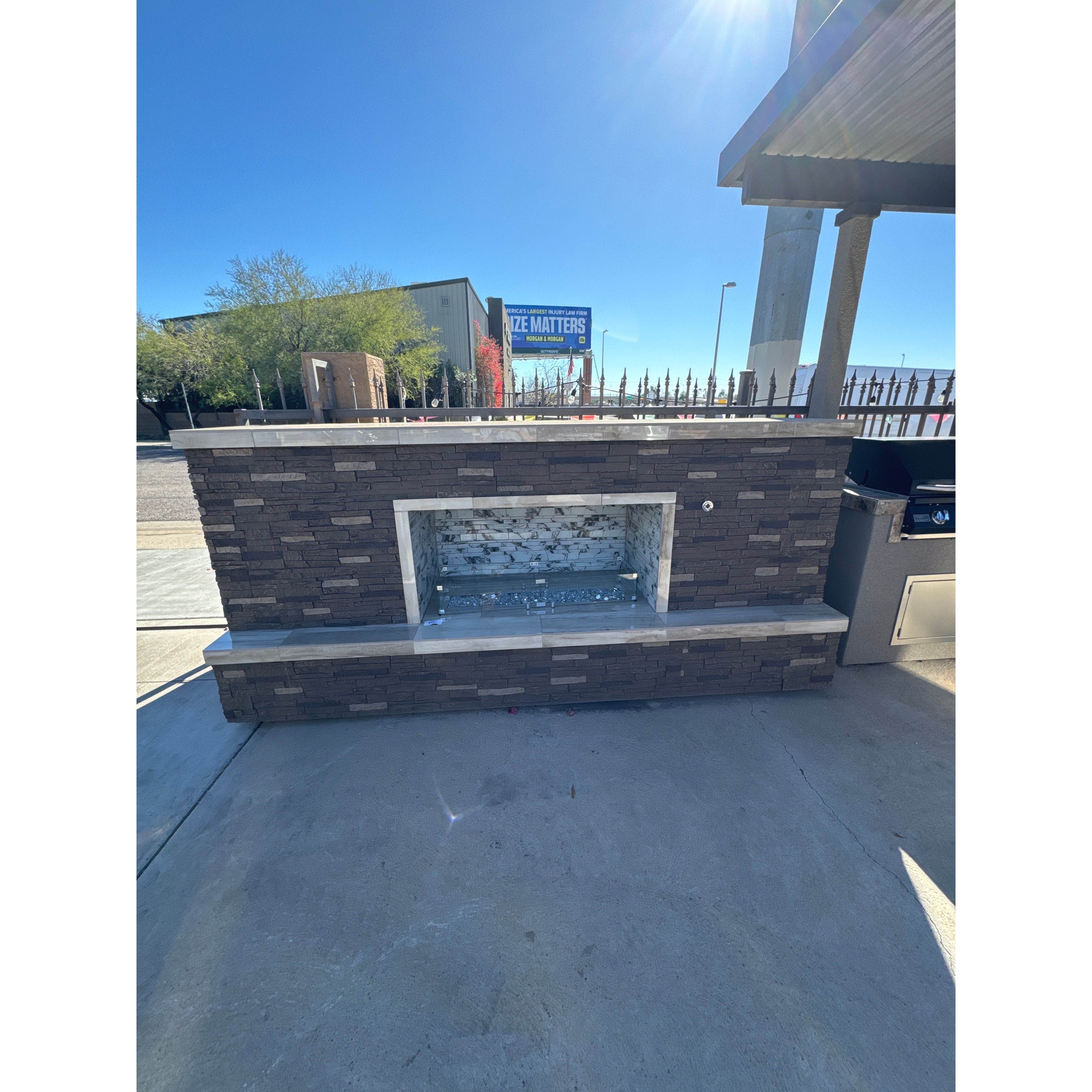 KoKoMo Entertainer Fireplace 10' with Stoning Sides & Glass Backsplash